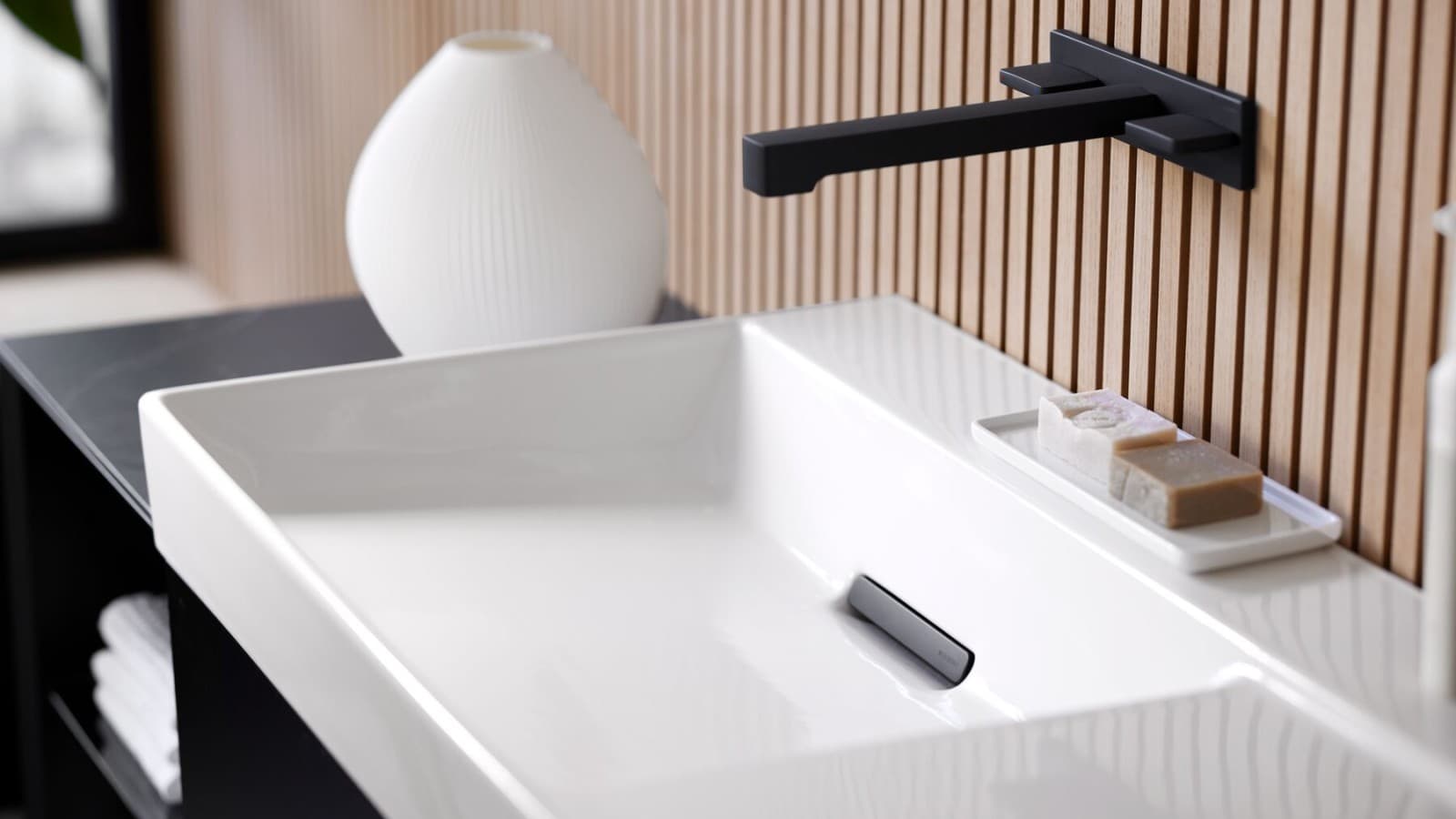 Washplace with black taps, bathroom furniture and accessories Washplace with black taps, bathroom furniture and accessories