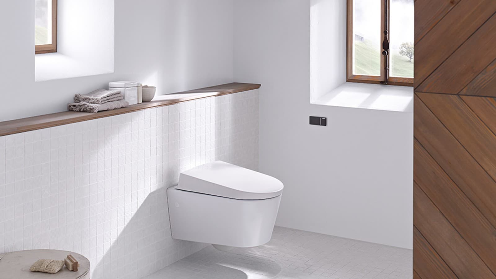 Rustic bathroom with wall-hung toilet and Geberit pre-wall toilet system Rustic bathroom with wall-hung toilet and Geberit pre-wall toilet system